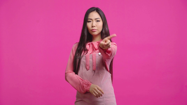 displeased kazakh woman showing no gesture isolated on pink  - Video