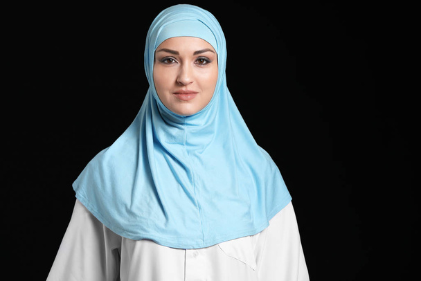 Beautiful Arab woman on dark background - Фото, изображение