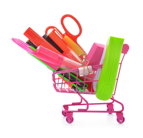 Shopping cart with school supplies on white background - Photo, Image