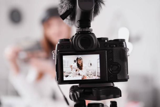 Young beauty blogger recording video at home - Foto, imagen