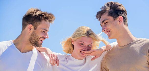 Member friendship wishes to enter into romantic relationship. Friendship love. Friendship relations. Friend zone concept. Happy together. Cheerful friends. People outdoors. Happy woman and two men - Фото, изображение