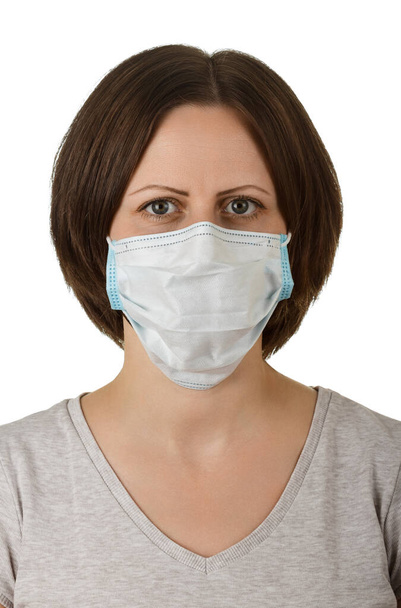 Woman in disposable medical protective mask isolated on white background - Foto, Imagen