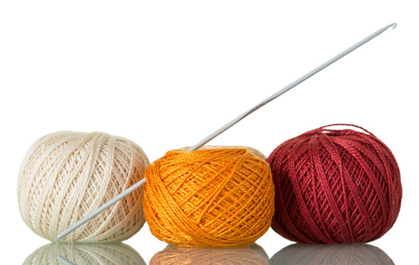 Three skeins of cotton yarn and crochet hook, isolated on white background - Foto, immagini