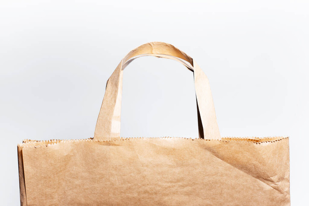 Close-up of eco paper bag isolated on white background. - Photo, Image