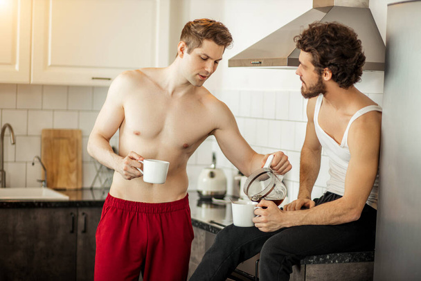 happy married gay couple at home - 写真・画像