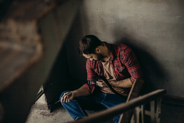 man addicted to drugs exhausted of such life - Valokuva, kuva