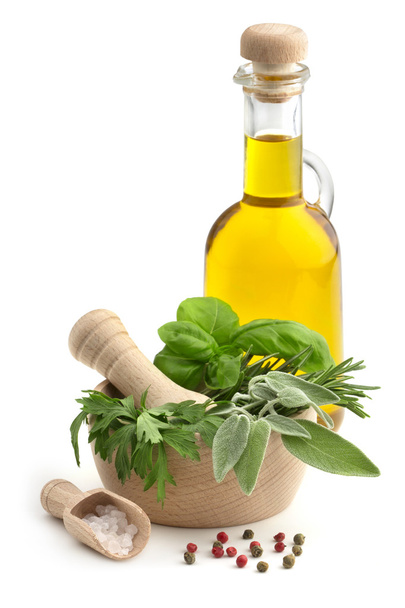 Mortar and pestle with herbs, spices and olive oil - Valokuva, kuva