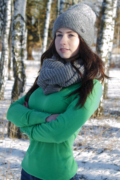 Spring photo shoot of a girl on a snow-covered nature background. - Photo, Image