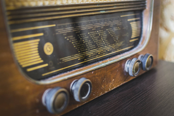 Close up on old vintage radio on hardwood . Selective focus. - Photo, Image