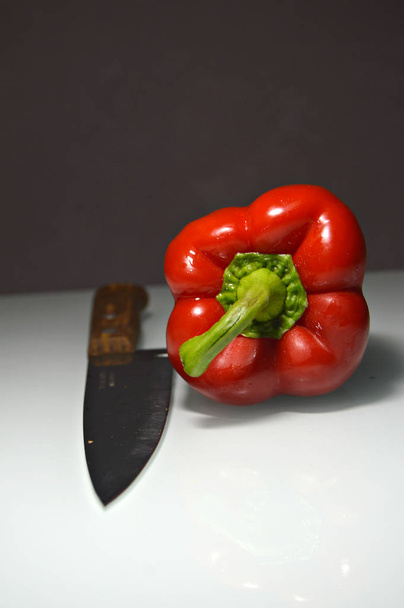 red bell pepper on a table - Фото, изображение