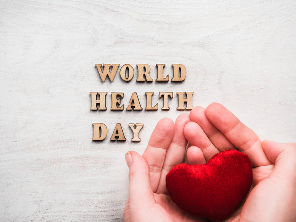 WORLD HEALTH DAY. Beautiful card. Isolated background, wooden surface. Congratulations for relatives, friends, colleagues - Foto, Imagem