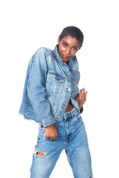 Slender young African American woman in distressed denim - Foto, imagen