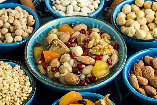 Traditional Turkish Dessert Asure,Ashura or Noah Pudding in the stylish blue color ceramic bowls. - Foto, afbeelding