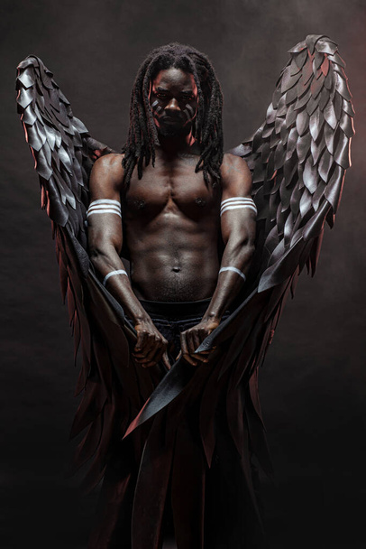 muscular black man in the flesh of angel - Foto, Imagen