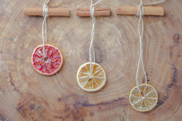 Dried red oranges, limes and lemons on wooden background with copy space - Fotoğraf, Görsel