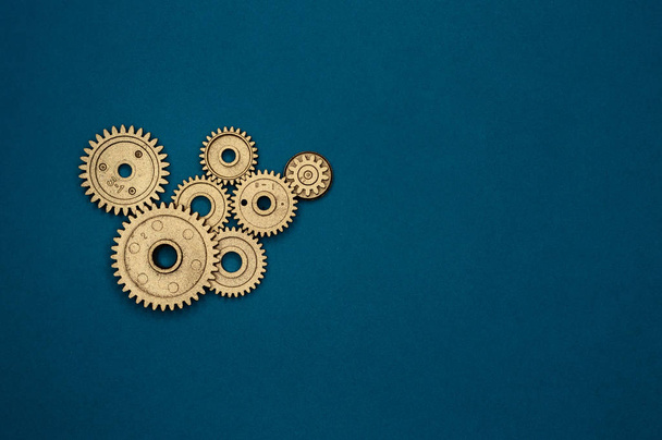 Template of golden plastic gears for industry projects or mechanics topics. - Foto, afbeelding