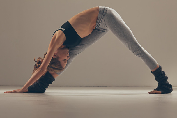 Woman Doing Yoga Indoors - Фото, зображення