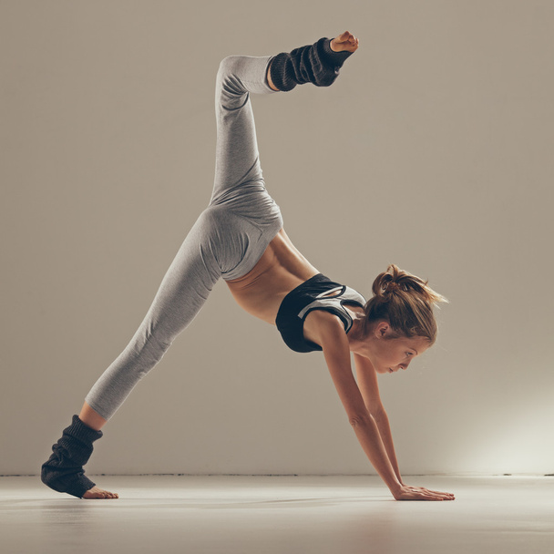 Young Woman Doing Yoga Indoors - Фото, изображение