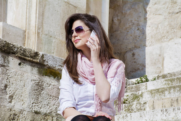 Portrait of Beautiful Smiling  Woman Talking on the Phone Outdoor  - Φωτογραφία, εικόνα