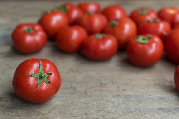 Fresh, red tomatoes on old wooden background with space for text - Photo, Image