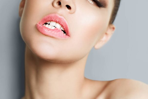 Licking lips. Close-up of young woman licking lips. - Foto, Imagem