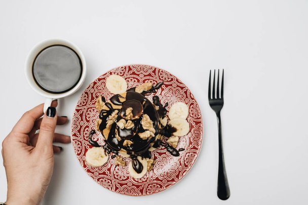 Homemade pancakes with banana and chocolate. Breakfast time - Photo, Image