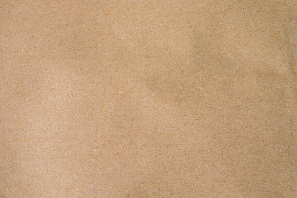 Bruin papier, ambachtelijke abstracte achtergrond. Retro, oude antieke vintage papier kunst patroon textuur achtergrond. Detail karton textuur van patroon met vrije ruimte kopie voor tekst, vignet effect. - Foto, afbeelding