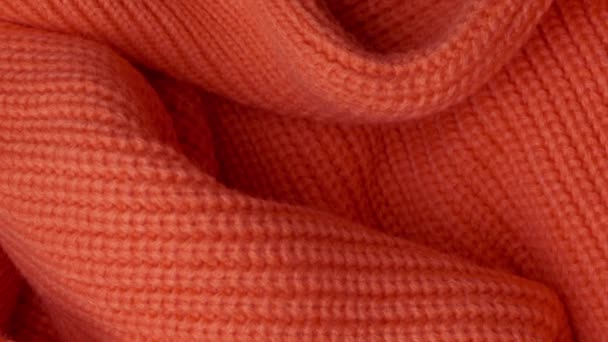 powierzchnia dzianego swetra z wełny pomarańczowej - Materiał filmowy, wideo