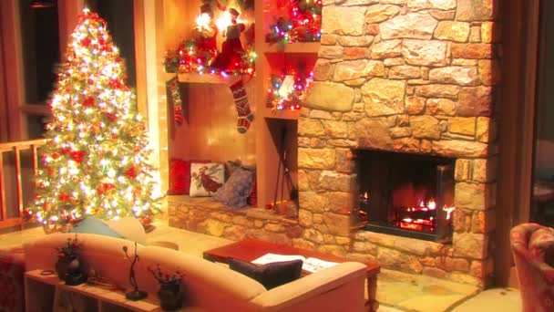 Wonderful festive Christmas tree New Year Eve room decoration atmosphere loop view on log firewood burning in fireplace - Footage, Video