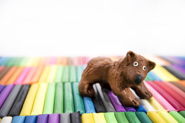 Play clay Animals. Bear on colored background. - Fotoğraf, Görsel
