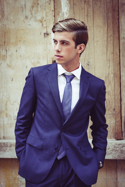 Attractive young businessman in urban background - Photo, Image