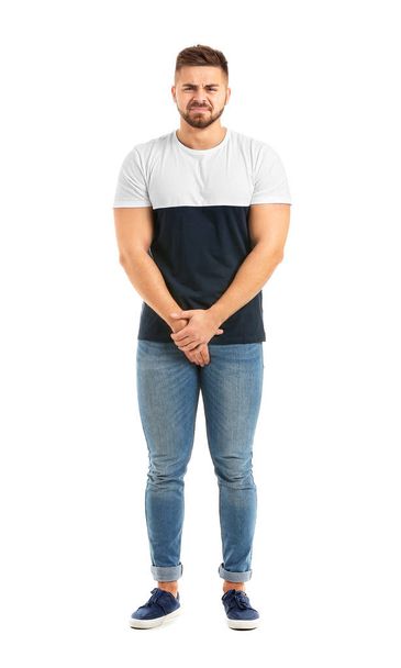 Young man with urologic disease on white background - Φωτογραφία, εικόνα