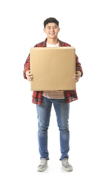 Asian man with moving boxes on white background - Foto, afbeelding