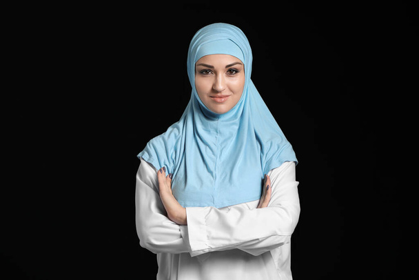 Beautiful Arab woman on dark background - Photo, Image