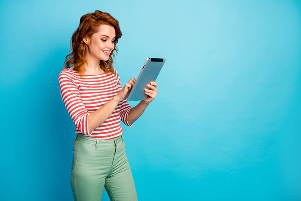Portrait of positive cheerful woman use tablet rest relax chilling searching blog post apps wear good look jumper isolated over blue color background - Foto, Bild