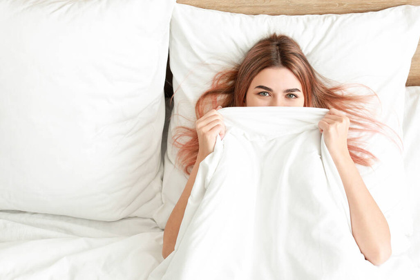 Morning of beautiful young woman in bed - Фото, зображення
