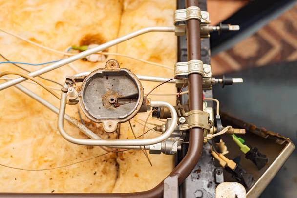 gas stove repair. disassembled old kitchen cooking equipment - 写真・画像