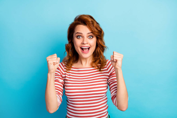 Portrait of ecstatic girl win desire wish lottery goal scream yeah raise fists wear good look outfit jumper isolated over blue color background - Foto, Imagem