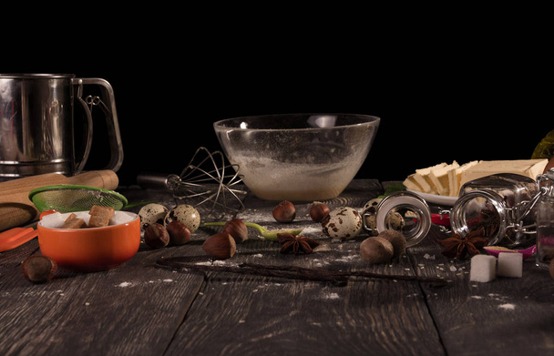 Set of products for biscuit, bowl and whisk, isolated on black background - Foto, Imagem