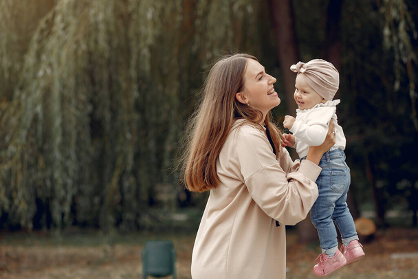 Mother with little child spend time in a park - Foto, Imagen