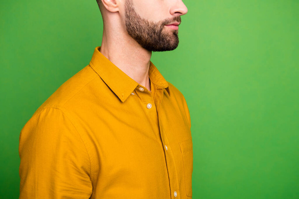 Cropped close-up profile side view portrait of his he nice attractive calm content serious well-groomed bearded guy in formal shirt isolated on bright vivid shine vibrant green color background - Foto, Bild