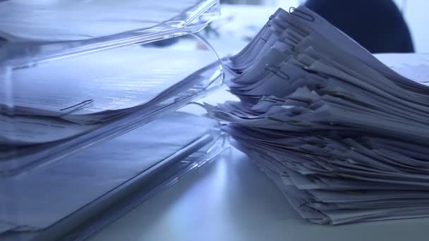 Stacks of documents in the office - close up. Darker clips. Camera moves, pan movement. - Footage, Video