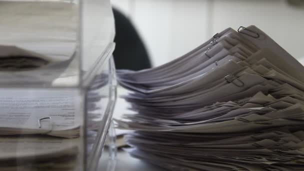 Stacks of documents in the office - close up. Darker clips. Camera moves, pan movement. - Footage, Video
