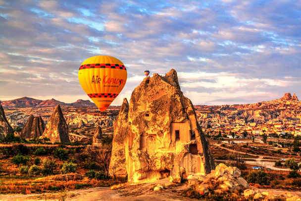 Colorful hot air balloons flying over the valley at Cappadocia, Anatolia, Turkey. Volcanic mountains in Goreme national park. - 写真・画像