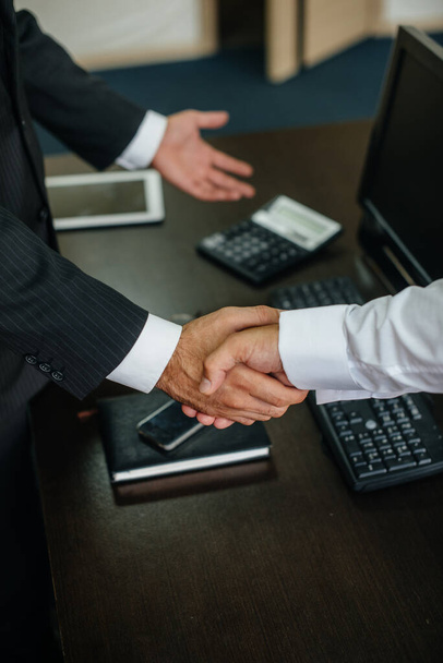 Close-up of the partners ' handshake, completion of the transaction in the office. Business - Photo, Image