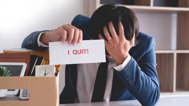 Businessman holding with I quit words card letter, resign employee Change of job concept - Photo, Image