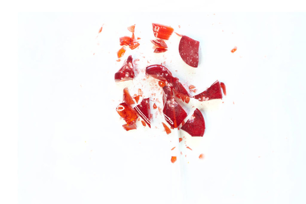 broken heart red lollipop sweet isolated on white background - Fotó, kép