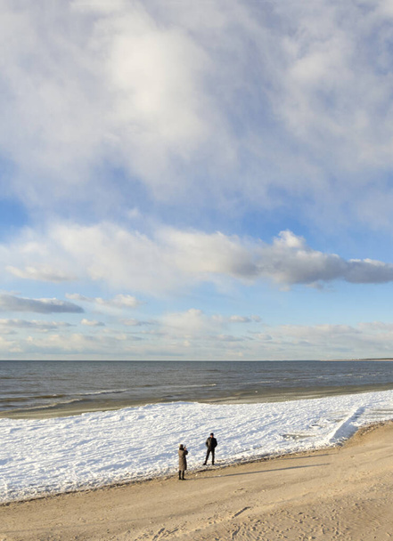A beautiful sandy winter beach in a sunny afternoon in Palanga, Lithuania - Photo, image