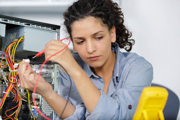 woman using power supply for the computer - Photo, image