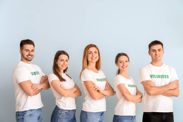 Team of volunteers on color background - Photo, Image